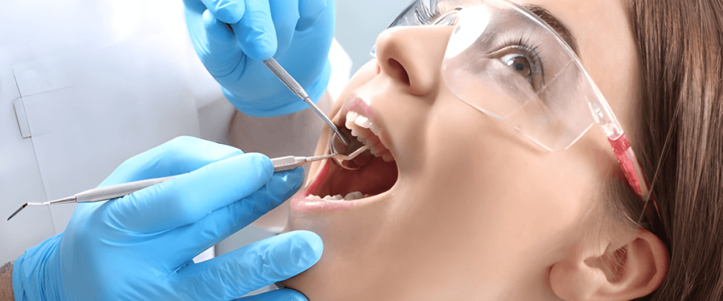 Child having dental cavity treatment at Vega Medical Center Dubai – dentist examining tooth with instrument.
